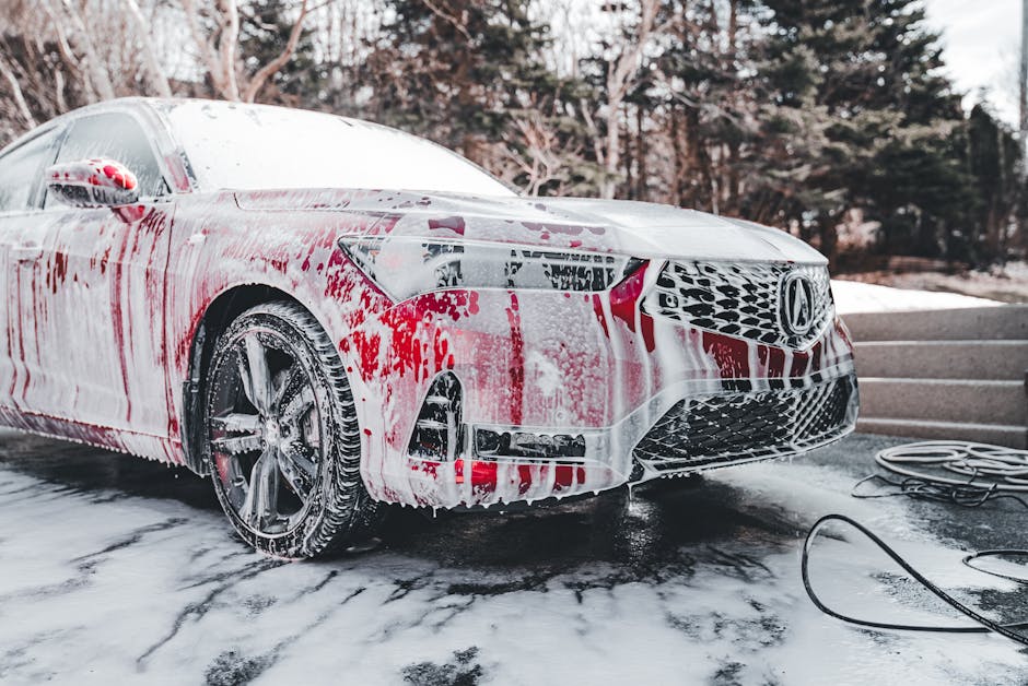 Professional foam cannon producing thick suds on a vehicle in New Orleans