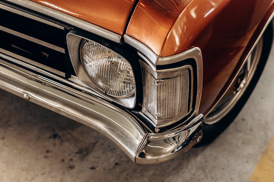 Close-up of a freshly restored headlight lens with a clear protective sealant applied