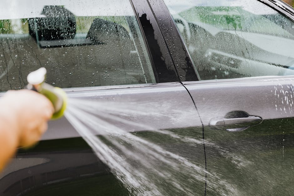 Maintenance wash being performed on a vehicle with existing ceramic coating protection