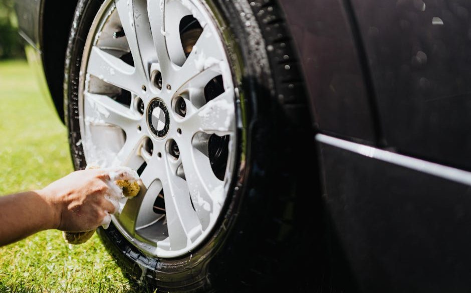 Iron fallout remover turning purple on a contaminated car rim during decontamination