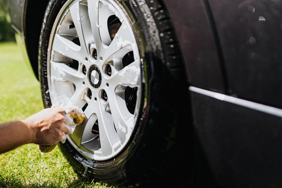 Iron fallout remover turning purple on a contaminated car rim during decontamination